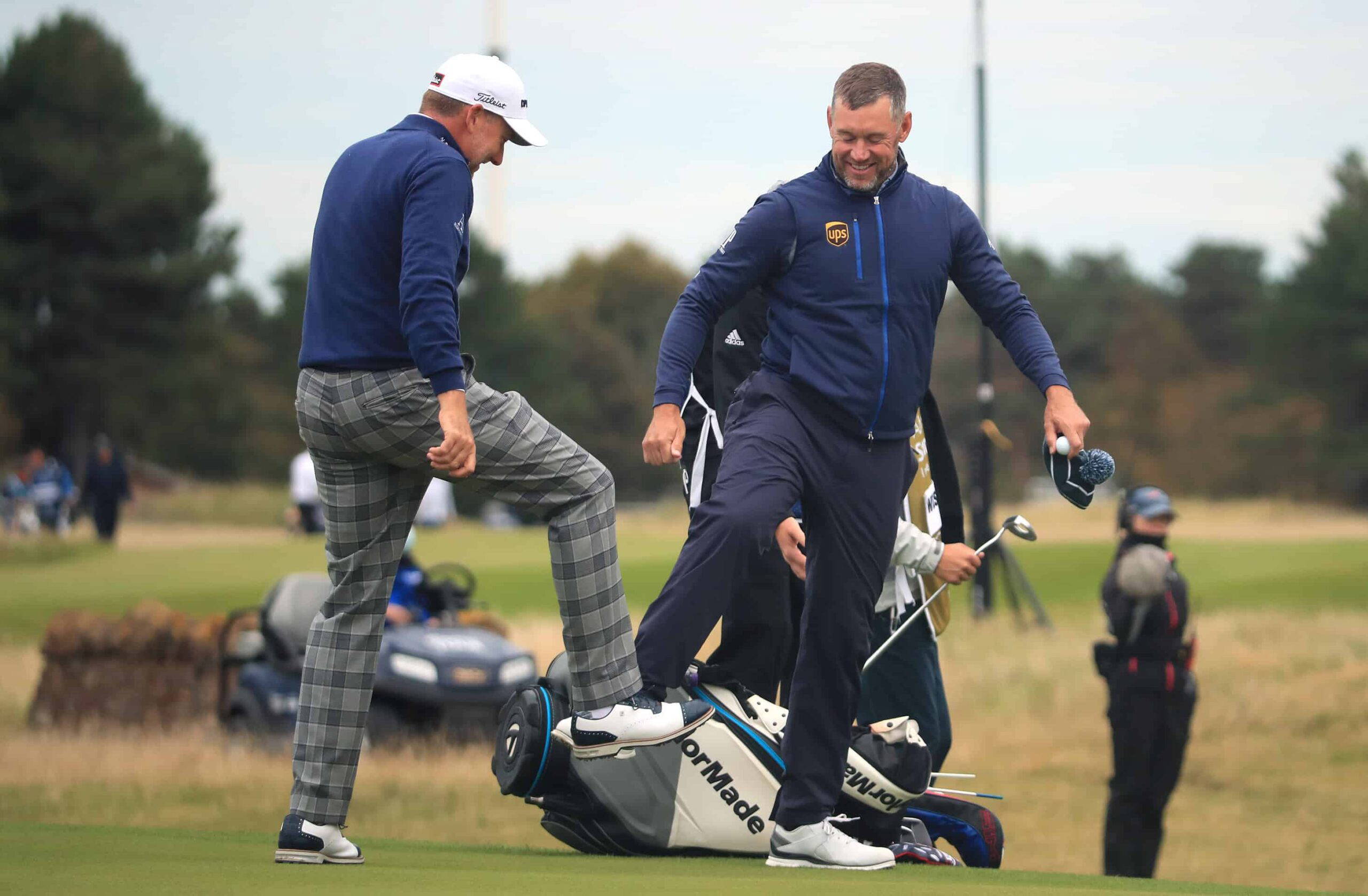 NORTH BERWICK, SCOTLAND - OCTOBER 01: Ian Poulter and Lee Westwood of England do a foot tap as a socially distanced acknowledgement after their first round of the Aberdeen Standard Investments Scottish Open at The Renaissance Club on October 01, 2020 in North Berwick, Scotland. (Photo by Andrew Redington/Getty Images)